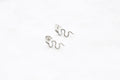 Tiny snake studs - silver